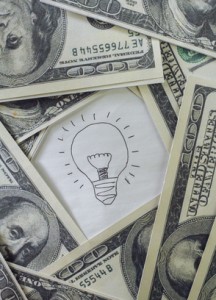 Lightbulb inside $100 bills